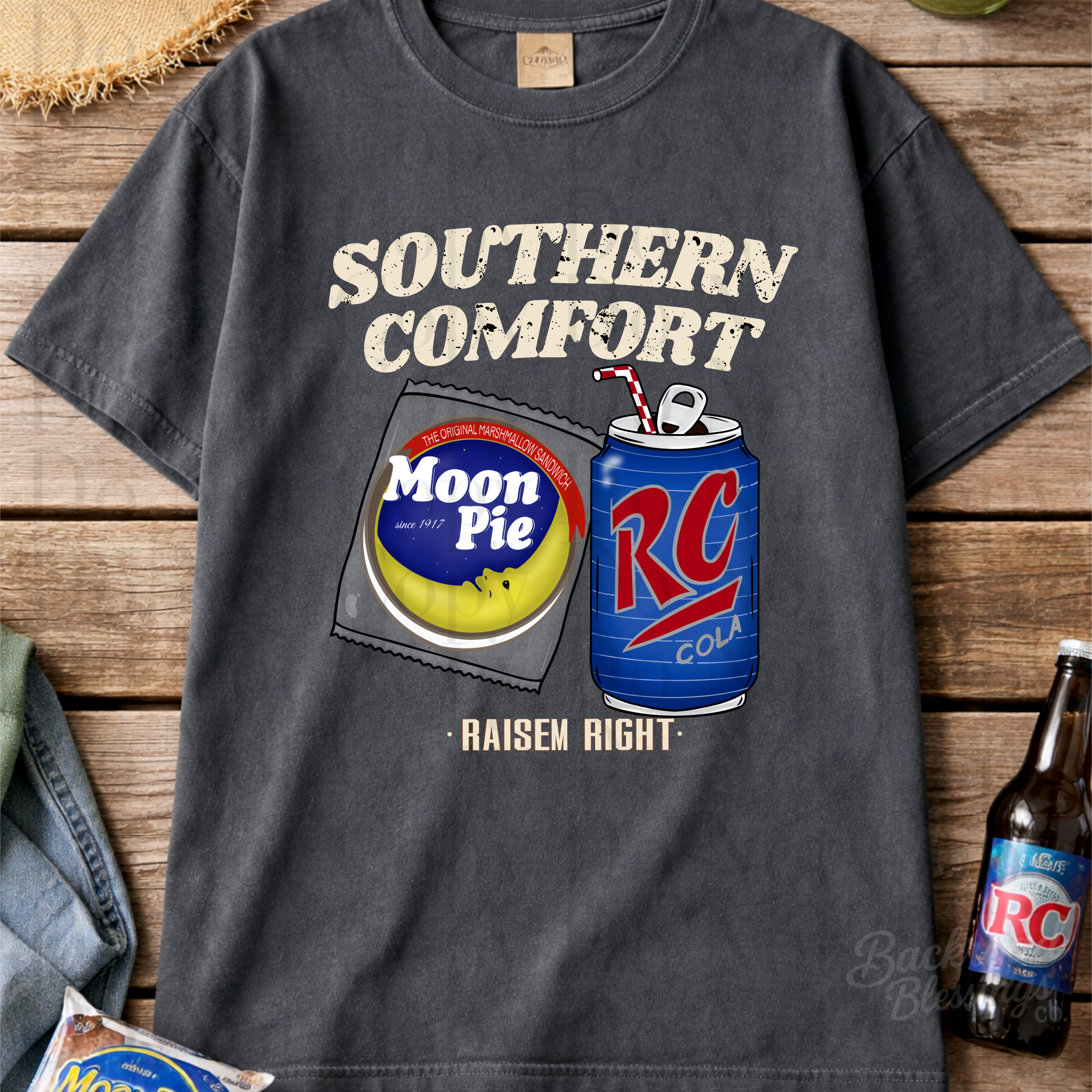 Old-school southern comfort PNG design shown on a dark vintage t-shirt flat lay for apparel mockup